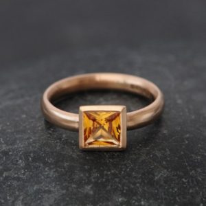 Shop Yellow Sapphire Jewelry! Princess Cut Yellow Sapphire Engagement Ring in 18K Gold | Natural genuine Yellow Sapphire jewelry. Buy handcrafted artisan wedding jewelry.  Unique handmade bridal jewelry gift ideas. #jewelry #beadedjewelry #gift #crystaljewelry #shopping #handmadejewelry #wedding #bridal #jewelry #affiliate #ad