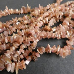 Shop Rhodochrosite Chip & Nugget Beads! 15-16 Inch 4-7mm Natural Rhodochrosite Chip Beads, About 220 Beads, Polished, Coral Pink Stone, Gemstone Spacer Bead, Small Drilled Gems | Natural genuine chip Rhodochrosite beads for beading and jewelry making.  #jewelry #beads #beadedjewelry #diyjewelry #jewelrymaking #beadstore #beading #affiliate #ad
