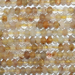 Shop Rutilated Quartz Rondelle Beads! 15" St Rutilated Quartz Faceted Rondelle Beads 6x4mm.-Strand 39cm. | Natural genuine rondelle Rutilated Quartz beads for beading and jewelry making.  #jewelry #beads #beadedjewelry #diyjewelry #jewelrymaking #beadstore #beading #affiliate #ad