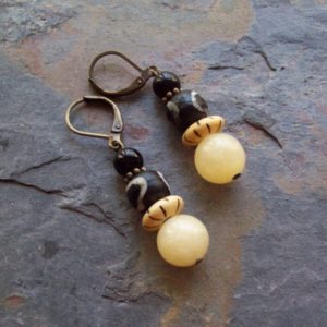 Adinkra – Ethnic Honey Yellow Calcite earrings with Carved Bone beads and Black Onyx #Earrings #yellow #gifts #ethnicjewelry #jewelry | Natural genuine Calcite earrings. Buy crystal jewelry, handmade handcrafted artisan jewelry for women.  Unique handmade gift ideas. #jewelry #beadedearrings #beadedjewelry #gift #shopping #handmadejewelry #fashion #style #product #earrings #affiliate #ad