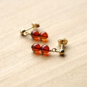 Shop Amber Earrings! Natural Amber Stud Earrings . Genuine Amber Earrings 14k Gold Filled . Small Stone Studs Dangle | Natural genuine Amber earrings. Buy crystal jewelry, handmade handcrafted artisan jewelry for women.  Unique handmade gift ideas. #jewelry #beadedearrings #beadedjewelry #gift #shopping #handmadejewelry #fashion #style #product #earrings #affiliate #ad