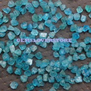 Shop Raw & Rough Apatite Stones! 50 Pieces Untreated Rough Size 4-6 Mm Genuine Natural Neon Blue Apatite Gemstone Aaa Quality Natural Rough Neon Apatite Loose Gemstone Lot | Natural genuine stones & crystals in various shapes & sizes. Buy raw cut, tumbled, or polished gemstones for making jewelry or crystal healing energy vibration raising reiki stones. #crystals #gemstones #crystalhealing #crystalsandgemstones #energyhealing #affiliate #ad