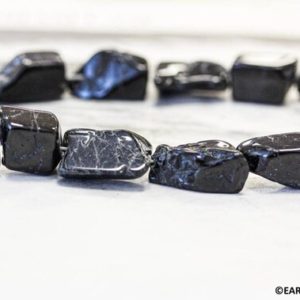 Shop Black Tourmaline Chip & Nugget Beads! M/ Black Tourmaline 9-10mm +/- Flat Nugget Loose Beads 15.5'' strand Shape/size varies Natural gemstone beads For jewelry making | Natural genuine chip Black Tourmaline beads for beading and jewelry making.  #jewelry #beads #beadedjewelry #diyjewelry #jewelrymaking #beadstore #beading #affiliate #ad