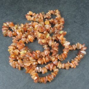 Shop Carnelian Chip & Nugget Beads! Carnelian Chip Beads 34 Inch Strand 5-10mm | Natural genuine chip Carnelian beads for beading and jewelry making.  #jewelry #beads #beadedjewelry #diyjewelry #jewelrymaking #beadstore #beading #affiliate #ad
