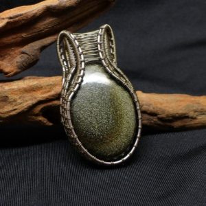 Shop Golden Obsidian Pendants! Pendentif obsidienne doré wire wrap, collier obsidienne, golden fire obsidian, pendentif elfique, bijoux elfique, cadeau unique pour elle | Natural genuine Golden Obsidian pendants. Buy crystal jewelry, handmade handcrafted artisan jewelry for women.  Unique handmade gift ideas. #jewelry #beadedpendants #beadedjewelry #gift #shopping #handmadejewelry #fashion #style #product #pendants #affiliate #ad