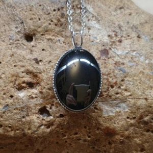 Shop Hematite Pendants! Simple oval Hematite pendant. Reiki jewelry uk. Grey semi precious stone. 18x13mm oval stone. 925 sterling silver necklaces for women. | Natural genuine Hematite pendants. Buy crystal jewelry, handmade handcrafted artisan jewelry for women.  Unique handmade gift ideas. #jewelry #beadedpendants #beadedjewelry #gift #shopping #handmadejewelry #fashion #style #product #pendants #affiliate #ad