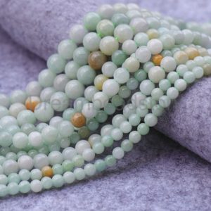 Shop Jade Round Beads! Natural Burma Jade Beads Round 6mm 8mm 10mm Green and Yellow Jadeite Gemstone Beads Sold by Strand | Natural genuine round Jade beads for beading and jewelry making.  #jewelry #beads #beadedjewelry #diyjewelry #jewelrymaking #beadstore #beading #affiliate #ad