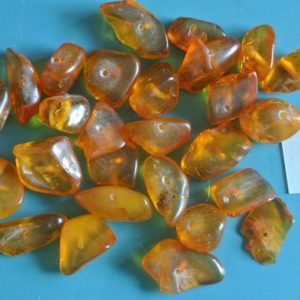 Shop Amber Chip & Nugget Beads! Lot of 27 vintage 1950s translucent goldbrown real natural organic baltic amber chip beads for your jewelry prodjects | Natural genuine chip Amber beads for beading and jewelry making.  #jewelry #beads #beadedjewelry #diyjewelry #jewelrymaking #beadstore #beading #affiliate #ad