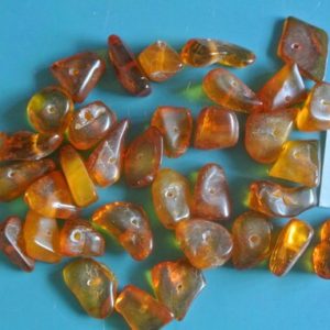 Shop Amber Chip & Nugget Beads! Lot of 35 vintage 1950s translucent light goldbrown real natural organic baltic amber chip beads for your jewelry prodjects | Natural genuine chip Amber beads for beading and jewelry making.  #jewelry #beads #beadedjewelry #diyjewelry #jewelrymaking #beadstore #beading #affiliate #ad