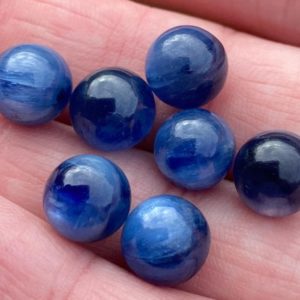 Shop Kyanite Shapes! One Tiny Blue Kyanite Sphere Chatoyant Gemmy Bright Blue Kyanite Sheen Deeb Blue | Natural genuine stones & crystals in various shapes & sizes. Buy raw cut, tumbled, or polished gemstones for making jewelry or crystal healing energy vibration raising reiki stones. #crystals #gemstones #crystalhealing #crystalsandgemstones #energyhealing #affiliate #ad