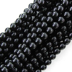 Shop Onyx Round Beads! AA grade 10mm black onyx round beads 15" strand | Natural genuine round Onyx beads for beading and jewelry making.  #jewelry #beads #beadedjewelry #diyjewelry #jewelrymaking #beadstore #beading #affiliate #ad