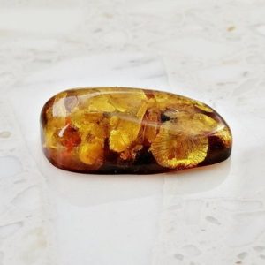 Shop Amber Cabochons! Polished big amber cabochon healing stone,baltic amber pendant, polish amber, amber cabochon, big amber, large amber, amber beads | Natural genuine stones & crystals in various shapes & sizes. Buy raw cut, tumbled, or polished gemstones for making jewelry or crystal healing energy vibration raising reiki stones. #crystals #gemstones #crystalhealing #crystalsandgemstones #energyhealing #affiliate #ad