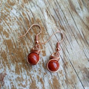 Shop Red Jasper Jewelry! Red Jasper Earrings, Fish hook earrings, wire wrapped jewelry, wire wrapped earrings, healing crystal earrings, copper jewelry | Natural genuine Red Jasper jewelry. Buy crystal jewelry, handmade handcrafted artisan jewelry for women.  Unique handmade gift ideas. #jewelry #beadedjewelry #beadedjewelry #gift #shopping #handmadejewelry #fashion #style #product #jewelry #affiliate #ad