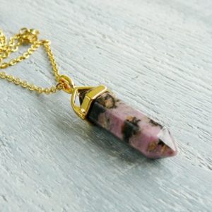 Rhodonite Necklace Natural Rhodonite Pendant Healing Crystal Necklace for Women Men Gemstone Necklace Gold Energy Crystals Point Pendant | Natural genuine Rhodonite pendants. Buy crystal jewelry, handmade handcrafted artisan jewelry for women.  Unique handmade gift ideas. #jewelry #beadedpendants #beadedjewelry #gift #shopping #handmadejewelry #fashion #style #product #pendants #affiliate #ad