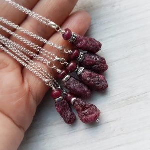 Shop Ruby Pendants! Raw ruby necklace/ Raw stone pendant / July birthstone necklace / Raw ruby pendant / Undyed ruby / Christmas gift for wife | Natural genuine Ruby pendants. Buy crystal jewelry, handmade handcrafted artisan jewelry for women.  Unique handmade gift ideas. #jewelry #beadedpendants #beadedjewelry #gift #shopping #handmadejewelry #fashion #style #product #pendants #affiliate #ad