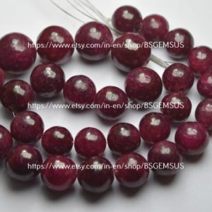 Shop Ruby Round Beads! 7 Inches Strand, natural Dyed Ruby Smooth Round Balls Beads, size 9-11mm Approx | Natural genuine round Ruby beads for beading and jewelry making.  #jewelry #beads #beadedjewelry #diyjewelry #jewelrymaking #beadstore #beading #affiliate #ad