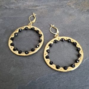 Shop Spinel Earrings! Black spinel hoop earrings, wavy circle earrings, intertwined beaded hoops, uneven round dangle, satin gold finish | Natural genuine Spinel earrings. Buy crystal jewelry, handmade handcrafted artisan jewelry for women.  Unique handmade gift ideas. #jewelry #beadedearrings #beadedjewelry #gift #shopping #handmadejewelry #fashion #style #product #earrings #affiliate #ad