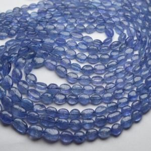Shop Tanzanite Bead Shapes! 8 Inches Strand,Finest Quality,Natural Tanzanite Smooth Oval Beads,Size 6-8mm | Natural genuine other-shape Tanzanite beads for beading and jewelry making.  #jewelry #beads #beadedjewelry #diyjewelry #jewelrymaking #beadstore #beading #affiliate #ad