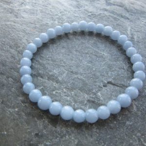 Shop Angelite Jewelry! The angelite bracelet 6mm! Great handmade stretch bracelet natural baby blue angelite 6mm Reiki infused | Natural genuine Angelite jewelry. Buy crystal jewelry, handmade handcrafted artisan jewelry for women.  Unique handmade gift ideas. #jewelry #beadedjewelry #beadedjewelry #gift #shopping #handmadejewelry #fashion #style #product #jewelry #affiliate #ad