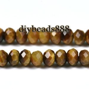 Shop Tiger Eye Faceted Beads! Yellow Tiger Eye,15 inch full strand Yellow Tiger Eye faceted rondelle beads,abacus beads,space beads 4x6mm | Natural genuine faceted Tiger Eye beads for beading and jewelry making.  #jewelry #beads #beadedjewelry #diyjewelry #jewelrymaking #beadstore #beading #affiliate #ad