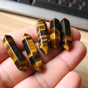 Shop Tiger Eye Points & Wands! Tiger eye point tiger's eye double terminated healing crystal | Natural genuine stones & crystals in various shapes & sizes. Buy raw cut, tumbled, or polished gemstones for making jewelry or crystal healing energy vibration raising reiki stones. #crystals #gemstones #crystalhealing #crystalsandgemstones #energyhealing #affiliate #ad