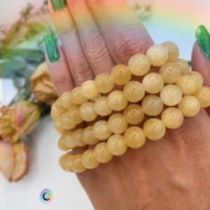 Shop Calcite Bracelets! Yellow Calcite Beaded Stretchy Crystal Bracelets | 8mm beads | Solar Plexus Chakra | Crystal for cheer | Natural genuine Calcite bracelets. Buy crystal jewelry, handmade handcrafted artisan jewelry for women.  Unique handmade gift ideas. #jewelry #beadedbracelets #beadedjewelry #gift #shopping #handmadejewelry #fashion #style #product #bracelets #affiliate #ad