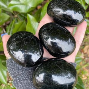 Shop Black Tourmaline Shapes! Black Tourmaline Palm Stone, Black Tourmaline, Qty. 1 | Natural genuine stones & crystals in various shapes & sizes. Buy raw cut, tumbled, or polished gemstones for making jewelry or crystal healing energy vibration raising reiki stones. #crystals #gemstones #crystalhealing #crystalsandgemstones #energyhealing #affiliate #ad