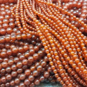 Shop Carnelian Round Beads! Carnelian Polished Round Beads, 15 inch | Natural genuine round Carnelian beads for beading and jewelry making.  #jewelry #beads #beadedjewelry #diyjewelry #jewelrymaking #beadstore #beading #affiliate #ad