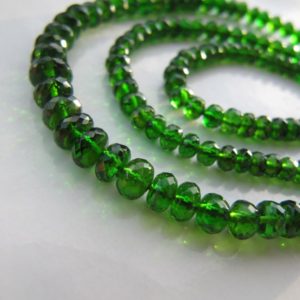 Shop Diopside Faceted Beads! Chrome Diopside Rondelles • Fantastic NEW ARRIVAL • 3.50-6mm • AAA+ Micro Faceted • Vivid Dark Bottle Green • Rare Find | Natural genuine faceted Diopside beads for beading and jewelry making.  #jewelry #beads #beadedjewelry #diyjewelry #jewelrymaking #beadstore #beading #affiliate #ad
