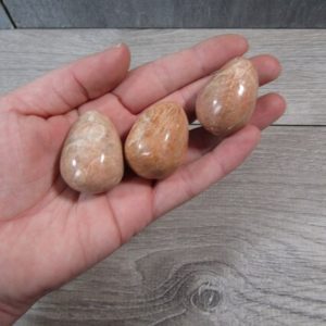 Shop Moonstone Stones & Crystals! Peach Moonstone Egg Shaped Stone | Natural genuine stones & crystals in various shapes & sizes. Buy raw cut, tumbled, or polished gemstones for making jewelry or crystal healing energy vibration raising reiki stones. #crystals #gemstones #crystalhealing #crystalsandgemstones #energyhealing #affiliate #ad