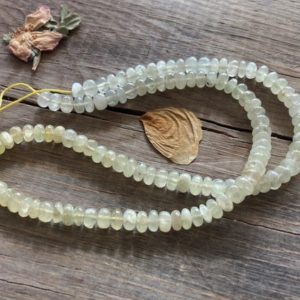 Shop Prehnite Rondelle Beads! Natural Glowing Lemon Prehnite Gemstone Smooth Rondelle Beads ~ 15" Strand ~ 5mm-5.5mm ~ Lovely Graduated Color | Natural genuine rondelle Prehnite beads for beading and jewelry making.  #jewelry #beads #beadedjewelry #diyjewelry #jewelrymaking #beadstore #beading #affiliate #ad