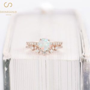 Shop Opal Rings! Round cut Natural Opal Engagement ring Vintage Rose Gold Bridal Unique Curved Half Eternity Art deco Diamond/Moissanite Wedding Promise ring | Natural genuine Opal rings, simple unique alternative gemstone engagement rings. #rings #jewelry #bridal #wedding #jewelryaccessories #engagementrings #weddingideas #affiliate #ad