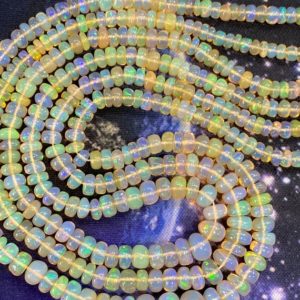 Prettiest natural Ethiopian Earth Opal Rondelles 3mm/ spectrum of soft fiery oranges, blue, brown, green, gold | Natural genuine beads Gemstone beads for beading and jewelry making.  #jewelry #beads #beadedjewelry #diyjewelry #jewelrymaking #beadstore #beading #affiliate #ad