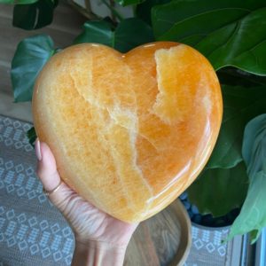 Shop Orange Calcite Stones & Crystals! XL orange calcite heart, extra gemmy | Natural genuine stones & crystals in various shapes & sizes. Buy raw cut, tumbled, or polished gemstones for making jewelry or crystal healing energy vibration raising reiki stones. #crystals #gemstones #crystalhealing #crystalsandgemstones #energyhealing #affiliate #ad