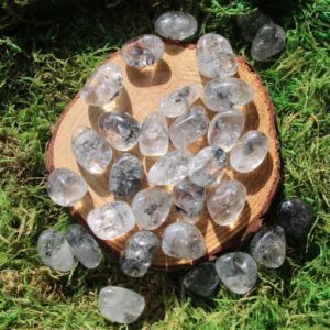Shop Tumbled Quartz Crystals & Pocket Stones! Black Mineral Included Clear Quartz Tumbled Medium | Natural genuine stones & crystals in various shapes & sizes. Buy raw cut, tumbled, or polished gemstones for making jewelry or crystal healing energy vibration raising reiki stones. #crystals #gemstones #crystalhealing #crystalsandgemstones #energyhealing #affiliate #ad