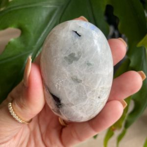 Shop Rainbow Moonstone Shapes! Rainbow Moonstone palm stone, with blue flash | Natural genuine stones & crystals in various shapes & sizes. Buy raw cut, tumbled, or polished gemstones for making jewelry or crystal healing energy vibration raising reiki stones. #crystals #gemstones #crystalhealing #crystalsandgemstones #energyhealing #affiliate #ad