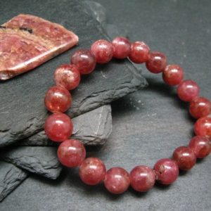 Shop Rhodochrosite Bracelets! Rhodochrosite Genuine Bracelet ~ 7 Inches  ~ 11mm Round Beads | Natural genuine Rhodochrosite bracelets. Buy crystal jewelry, handmade handcrafted artisan jewelry for women.  Unique handmade gift ideas. #jewelry #beadedbracelets #beadedjewelry #gift #shopping #handmadejewelry #fashion #style #product #bracelets #affiliate #ad