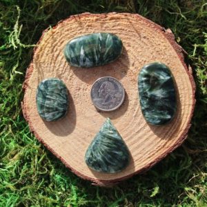 Shop Seraphinite Stones & Crystals! Seraphinite Cabochon Pieces #A-G | Natural genuine stones & crystals in various shapes & sizes. Buy raw cut, tumbled, or polished gemstones for making jewelry or crystal healing energy vibration raising reiki stones. #crystals #gemstones #crystalhealing #crystalsandgemstones #energyhealing #affiliate #ad