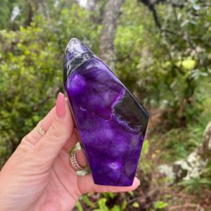 Shop Sugilite Stones & Crystals! Rare sugilite standing free from. Royal lavulite | Natural genuine stones & crystals in various shapes & sizes. Buy raw cut, tumbled, or polished gemstones for making jewelry or crystal healing energy vibration raising reiki stones. #crystals #gemstones #crystalhealing #crystalsandgemstones #energyhealing #affiliate #ad