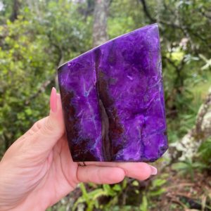 Shop Sugilite Stones & Crystals! Rare sugilite standing free from. Royal lavulite | Natural genuine stones & crystals in various shapes & sizes. Buy raw cut, tumbled, or polished gemstones for making jewelry or crystal healing energy vibration raising reiki stones. #crystals #gemstones #crystalhealing #crystalsandgemstones #energyhealing #affiliate #ad