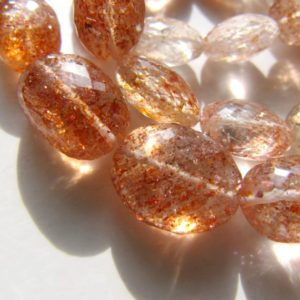 Shop Sunstone Chip & Nugget Beads! Sunstone oval nuggets • 10-14mm • AAA micro faceted gemstone drilled beads • Natural genuine • Shaded orange copper schiller gold clear | Natural genuine chip Sunstone beads for beading and jewelry making.  #jewelry #beads #beadedjewelry #diyjewelry #jewelrymaking #beadstore #beading #affiliate #ad