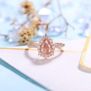 Shop Sunstone Jewelry! Pear Shaped Africa Sunstone Engagement ring Vintage Moissanite Diamond Halo ring Art deco rose gold half eternity Promise Anniversary ring | Natural genuine Sunstone jewelry. Buy handcrafted artisan wedding jewelry.  Unique handmade bridal jewelry gift ideas. #jewelry #beadedjewelry #gift #crystaljewelry #shopping #handmadejewelry #wedding #bridal #jewelry #affiliate #ad