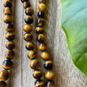 Shop Tiger Eye Bead Shapes! Golden tiger eye bead strand, 8mm beads, gemstone beads, tigers eye beads | Natural genuine other-shape Tiger Eye beads for beading and jewelry making.  #jewelry #beads #beadedjewelry #diyjewelry #jewelrymaking #beadstore #beading #affiliate #ad