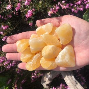 Shop Tumbled Orange Calcite Crystals & Pocket Stones! 1 pc Tumbled Orange Calcite | Natural genuine stones & crystals in various shapes & sizes. Buy raw cut, tumbled, or polished gemstones for making jewelry or crystal healing energy vibration raising reiki stones. #crystals #gemstones #crystalhealing #crystalsandgemstones #energyhealing #affiliate #ad