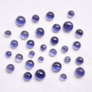 Shop Iolite Cabochons! Iolite Cabochons, Smooth Flat Back Gemstone, Iolite Round Shape Cabochon, 2.5mm To 5mm, Gemstone For Jewelry, 4 Carat, 15 Pcs Lot | Natural genuine stones & crystals in various shapes & sizes. Buy raw cut, tumbled, or polished gemstones for making jewelry or crystal healing energy vibration raising reiki stones. #crystals #gemstones #crystalhealing #crystalsandgemstones #energyhealing #affiliate #ad