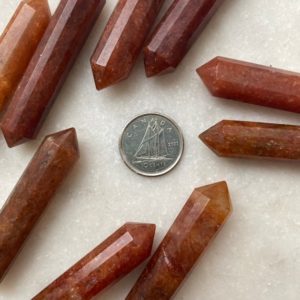 Shop Carnelian Points & Wands! Carnelian Double Terminated Vogel Wand 12-Faceted | Natural genuine stones & crystals in various shapes & sizes. Buy raw cut, tumbled, or polished gemstones for making jewelry or crystal healing energy vibration raising reiki stones. #crystals #gemstones #crystalhealing #crystalsandgemstones #energyhealing #affiliate #ad