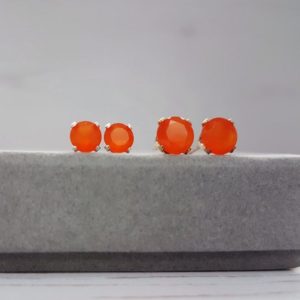 Shop Carnelian Earrings! Natural Carnelian stud earrings / 4mm or 5mm faceted studs in glorious bright orange / Christmas Gift for her / Stocking filler for her | Natural genuine Carnelian earrings. Buy crystal jewelry, handmade handcrafted artisan jewelry for women.  Unique handmade gift ideas. #jewelry #beadedearrings #beadedjewelry #gift #shopping #handmadejewelry #fashion #style #product #earrings #affiliate #ad