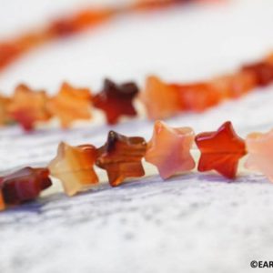 Shop Carnelian Bead Shapes! M/ Natural Carnelian 11mm Star beads 16" strand Routinely heated agate gemstone beads For jewelry making | Natural genuine other-shape Carnelian beads for beading and jewelry making.  #jewelry #beads #beadedjewelry #diyjewelry #jewelrymaking #beadstore #beading #affiliate #ad