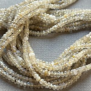 Shop Rutilated Quartz Rondelle Beads! Golden Rutilated Quartz beads 3mm faceted rondelles 13 inch strand | Natural genuine rondelle Rutilated Quartz beads for beading and jewelry making.  #jewelry #beads #beadedjewelry #diyjewelry #jewelrymaking #beadstore #beading #affiliate #ad