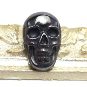 14 Carats Hematite Cabochon Skull Black Gunmetal AAA+ Grade Shiny Opaque Handmade Carved Halloween Day of the Dead Biker Carving Small | Natural genuine stones & crystals in various shapes & sizes. Buy raw cut, tumbled, or polished gemstones for making jewelry or crystal healing energy vibration raising reiki stones. #crystals #gemstones #crystalhealing #crystalsandgemstones #energyhealing #affiliate #ad